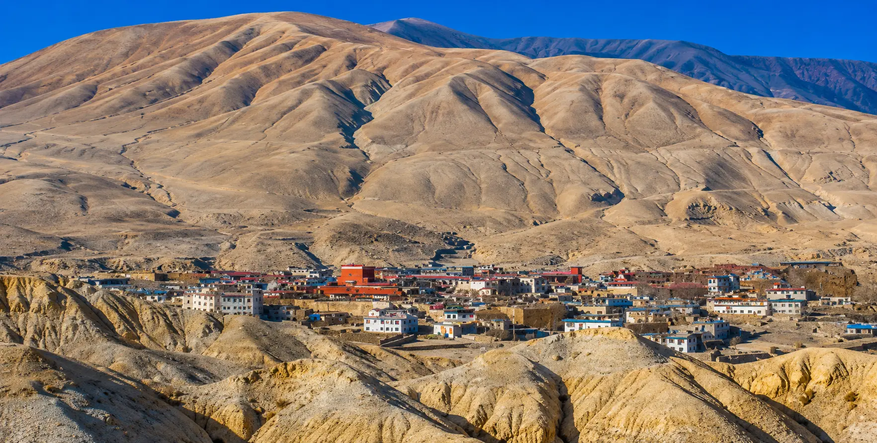 Pokhara to Lo Manthang Jeep Service | Upper Mustang Best Jeep Hire Private 4WD jeep traveling from Pokhara to Lo Manthang through the spectacular landscapes of Upper Mustang