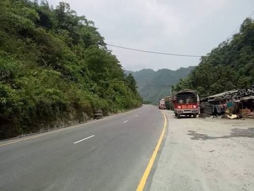 Kathmandu to Pokhara road conditions along the Prithvi Highway, with mountain scenery, rivers, and tourist vehicles in Nepal.