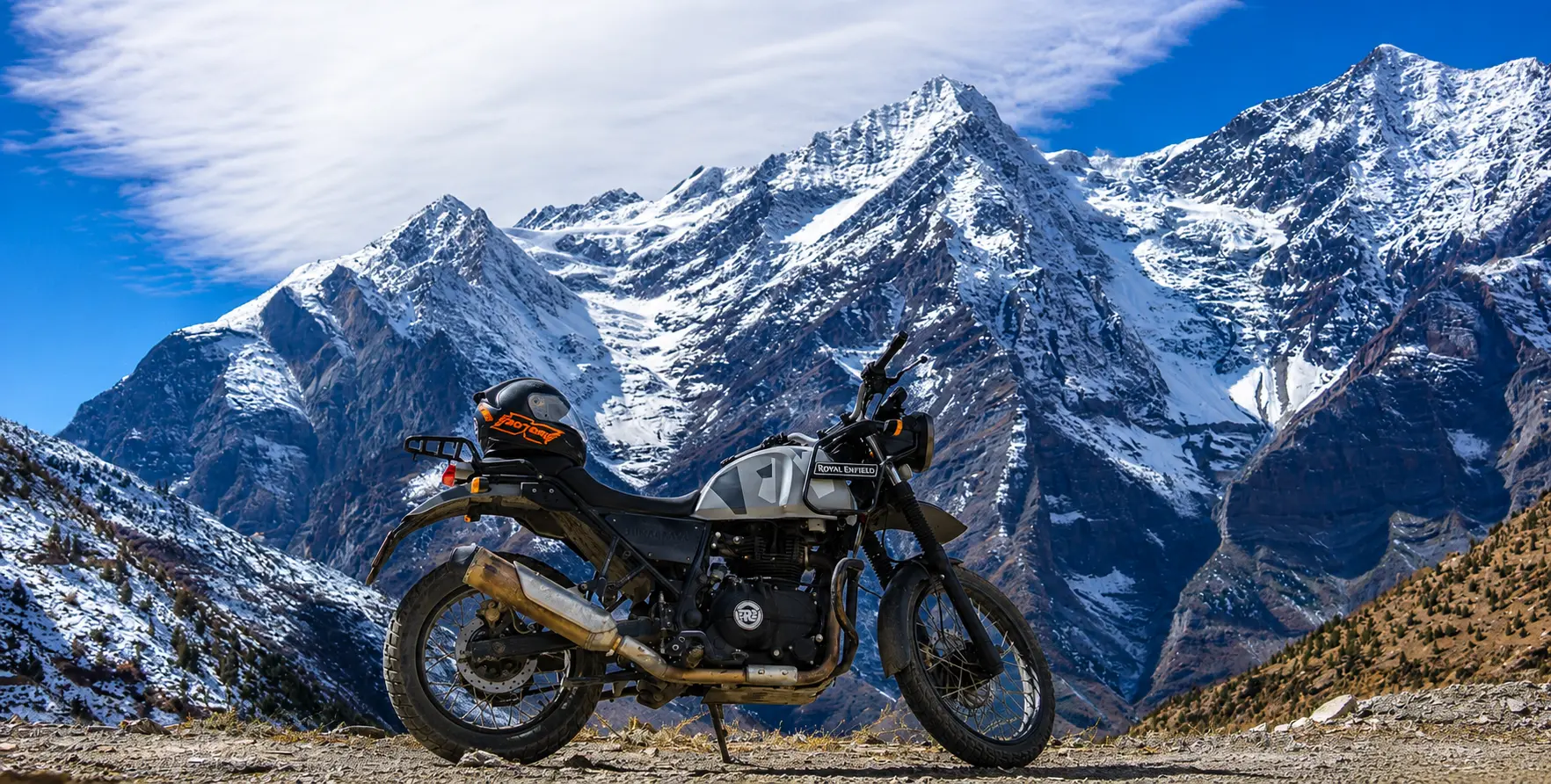 Royal Enfield Himalayan 450 adventure motorcycle in Mustang Valley with Himalayan mountains, Ne