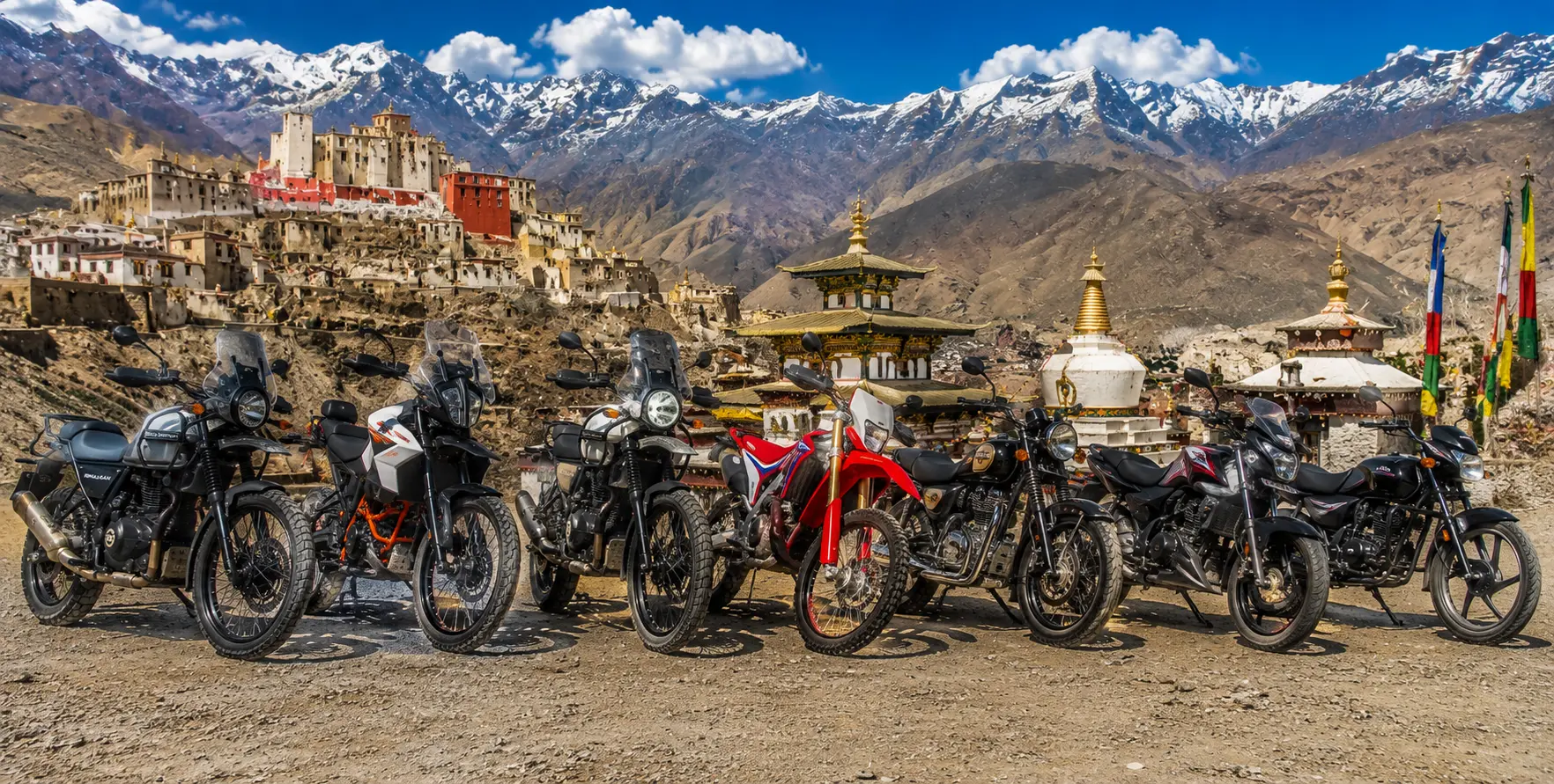 Royal Enfield Himalayan 450, KTM 390 Adventure R, Royal Enfield Himalayan 411, Royal Enfield Classic 350, Royal Enfield Classic 500, Bajaj Pulsar and Hero adventure motorcycles in Mustang Valley with the ancient Mustang Kingdom, Nepal.
