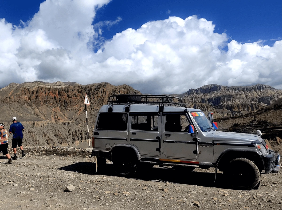 Pokhara to Lo Manthang Jeep Service | Upper Mustang Best Jeep Hire Private 4WD jeep traveling from Pokhara to Lo Manthang through the spectacular landscapes of Upper Mustang