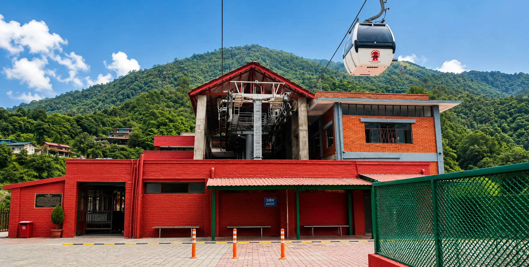 Private car and 4WD jeep at the Manakamana Cable Car station with Manakamana Temple in the background