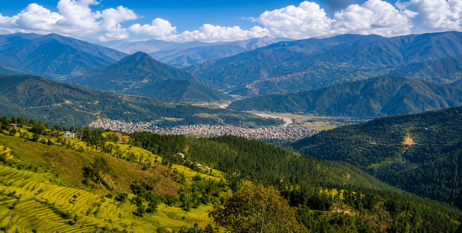 Panoramic view of Nuwakot, Nepal during the best travel season, featuring green hills, clear Himalayan skies, historic landmarks, and traditional villages.