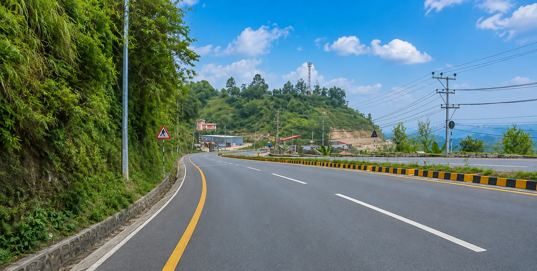 Kathmandu to Pokhara Road Condition | Prithvi Highway Nepal Kathmandu to Pokhara road conditions along the Prithvi Highway, with mountain scenery, rivers, and tourist vehicles in Nepal.Caption: