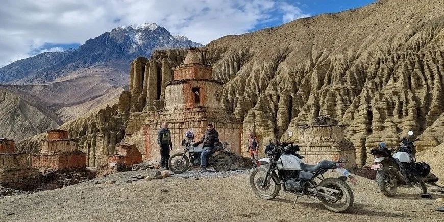 Royal Enfield Himalayan 450, KTM 390 Adventure R, Royal Enfield Himalayan 411, Royal Enfield Classic 350, Royal Enfield Classic 500, Bajaj Pulsar and Hero adventure motorcycles in Mustang Valley with the ancient Mustang Kingdom, Nepal.