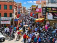 Female traveler exploring Nepal with Himalayan mountains and traditional Nepalese scenery